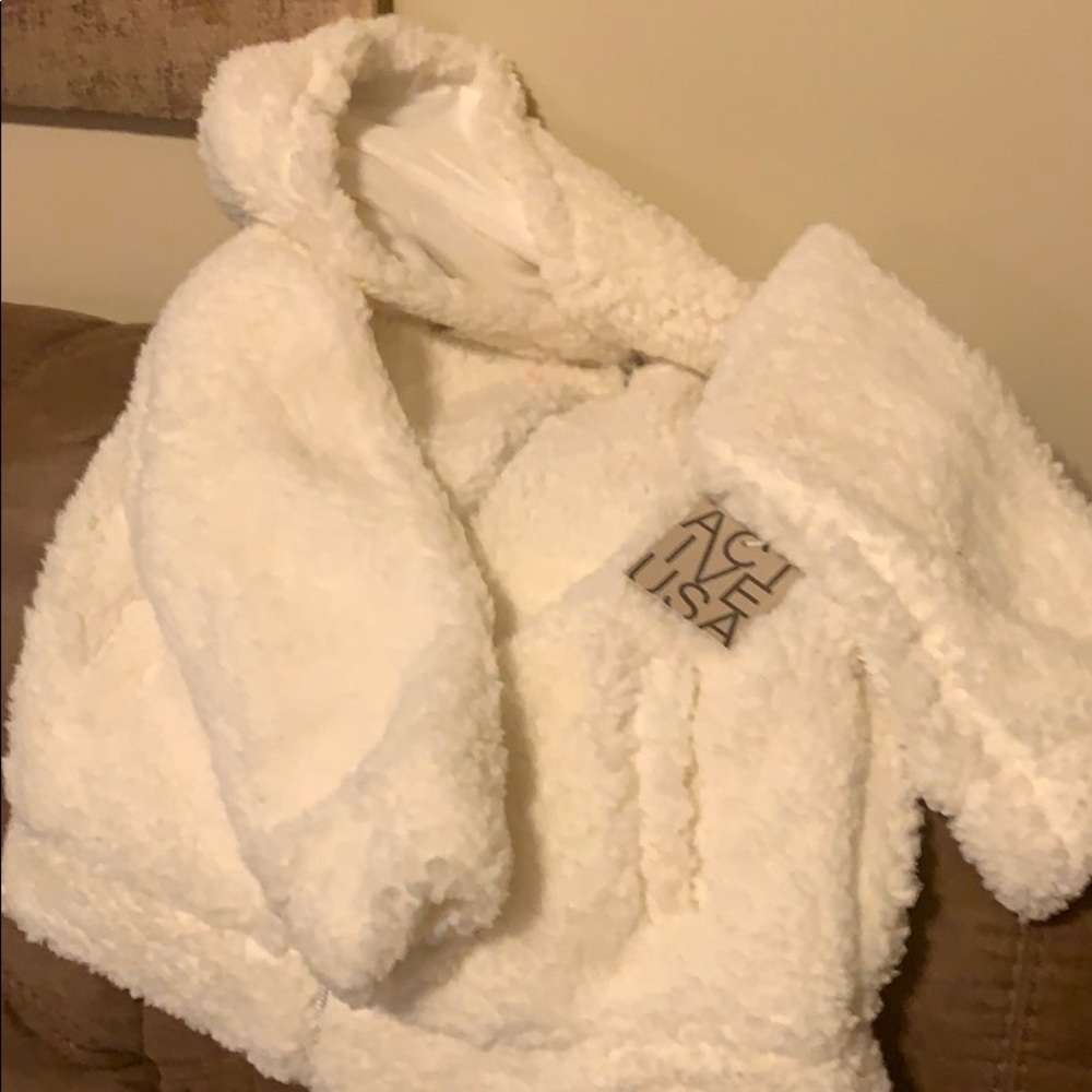Fur Jacket size Large with front zipper &hood.